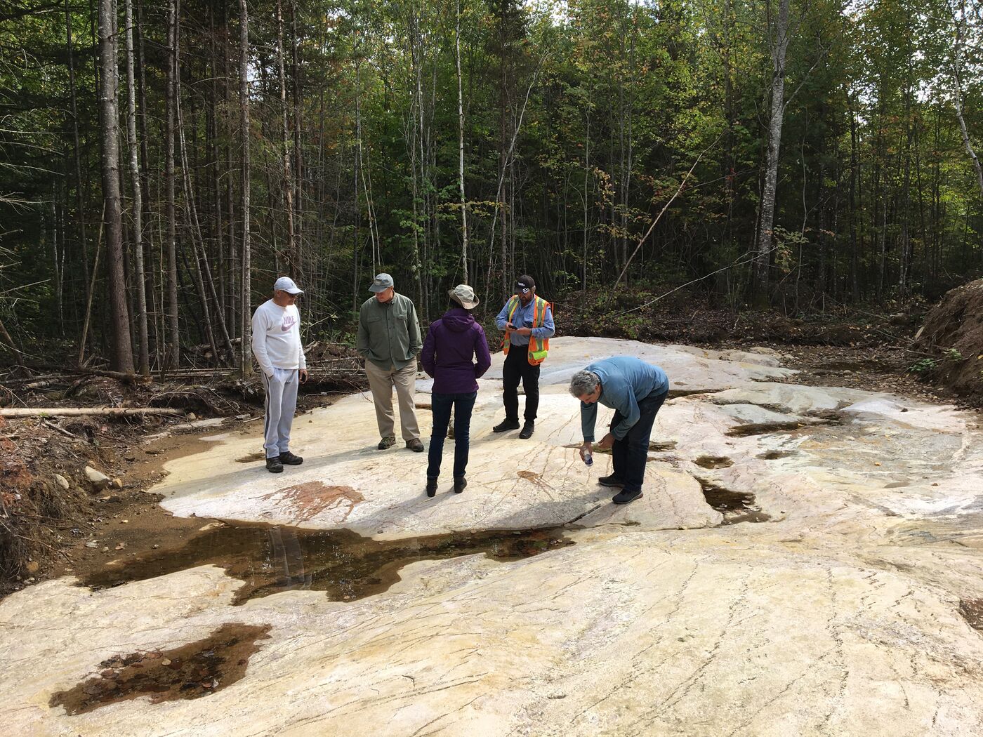 Field team on a rock outcrop